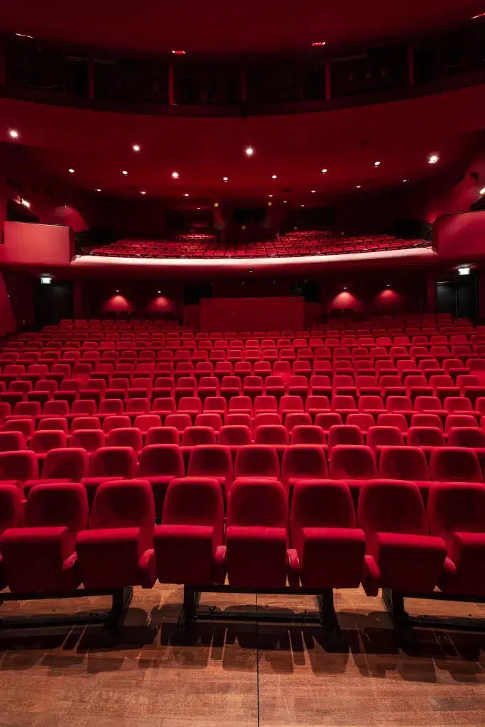 View from stage in empty theater with red seats